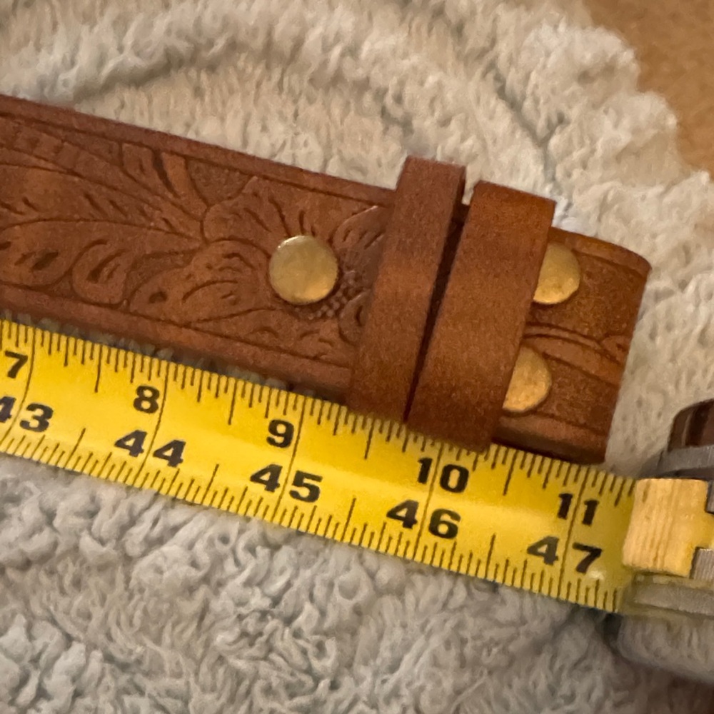 NWOT Brown Embossed Leather Belt without buckle. Never worn. Perfect condition.